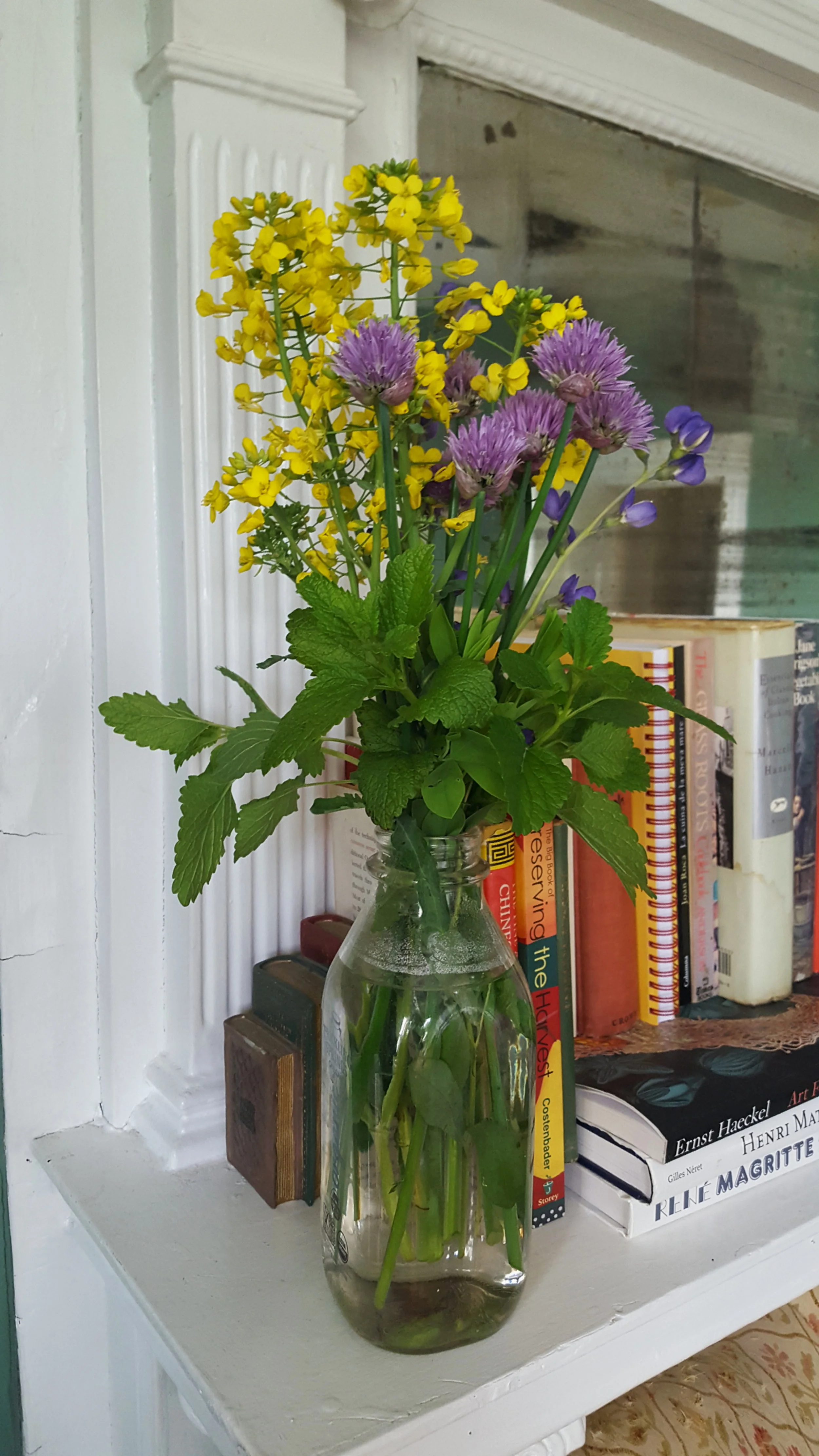 Bouquet of broccoli flower, chive flower, and lemon balm