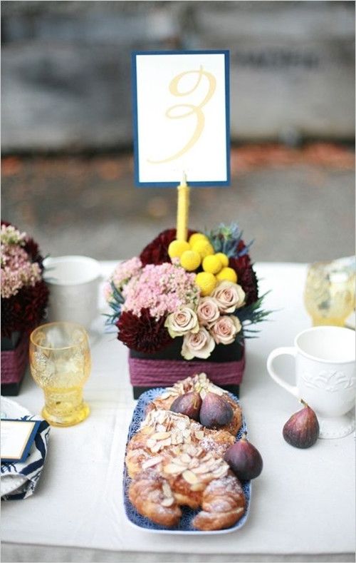 Colored glass, figs, floral bunches (invitesweddings.com)