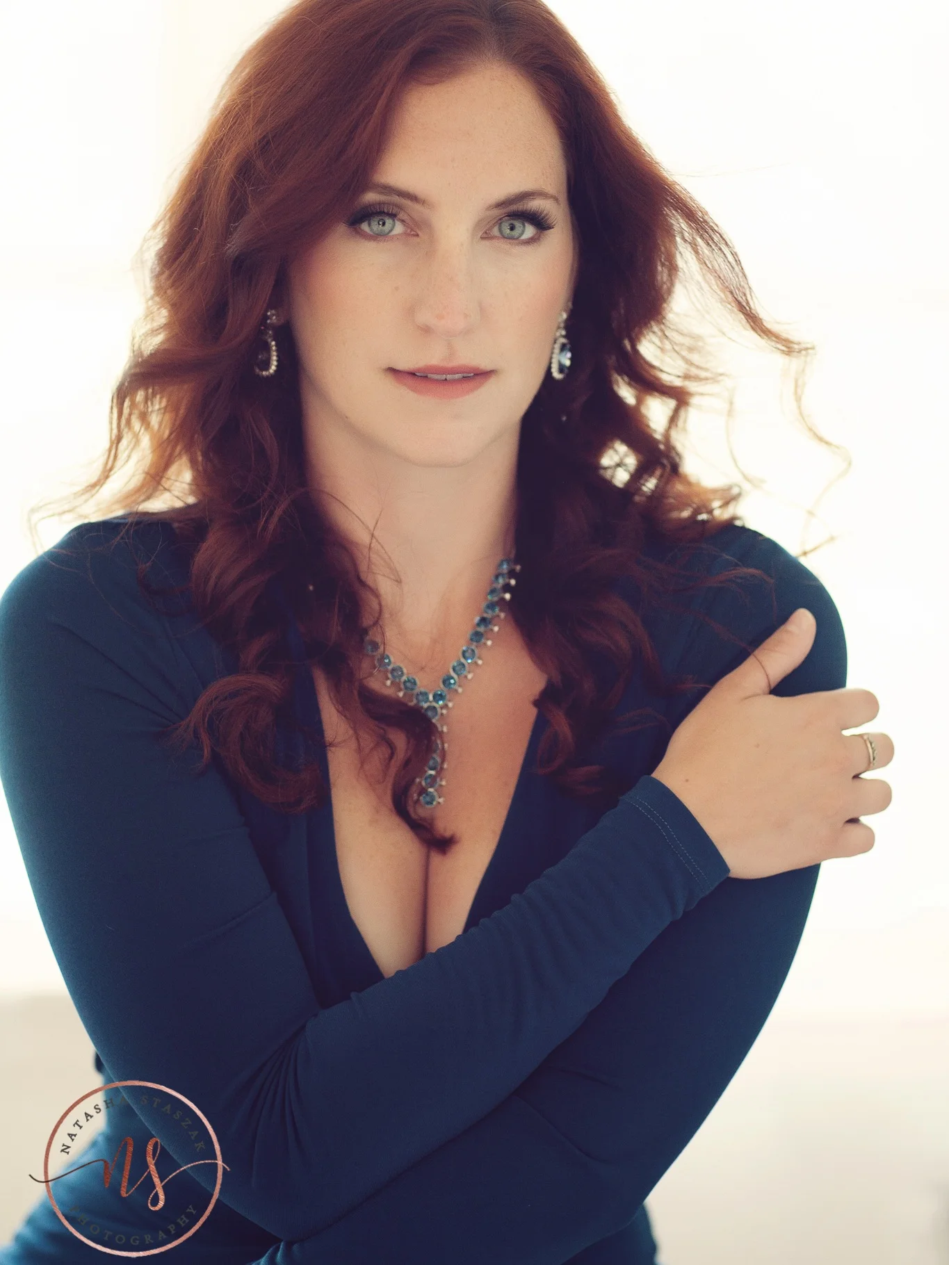 Portrait of Cortney Chyme in blue dress and red hair in Buffalo NY