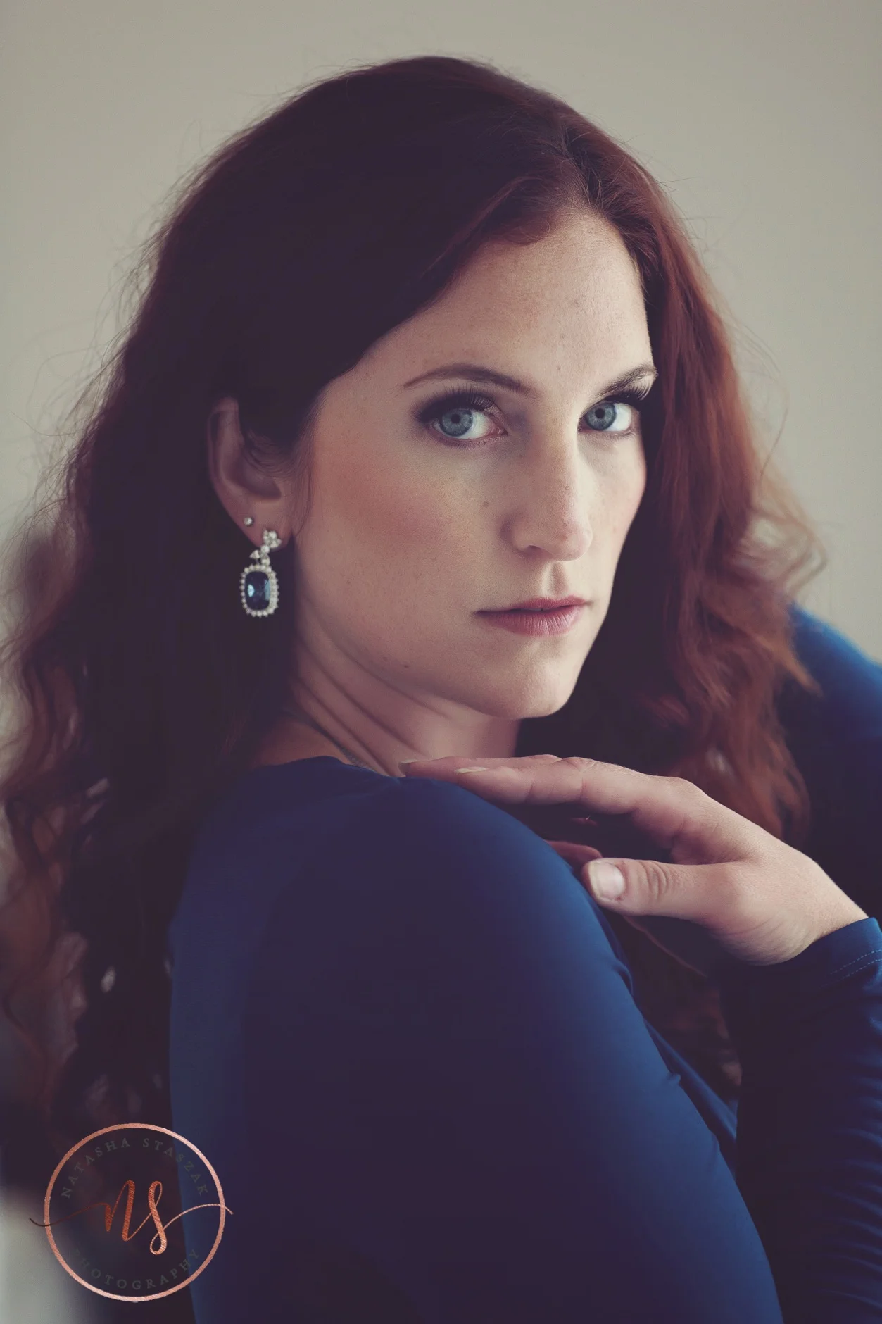 Beautiful Cortney Chyme portrait with blue dress and blue yes in Buffalo NY