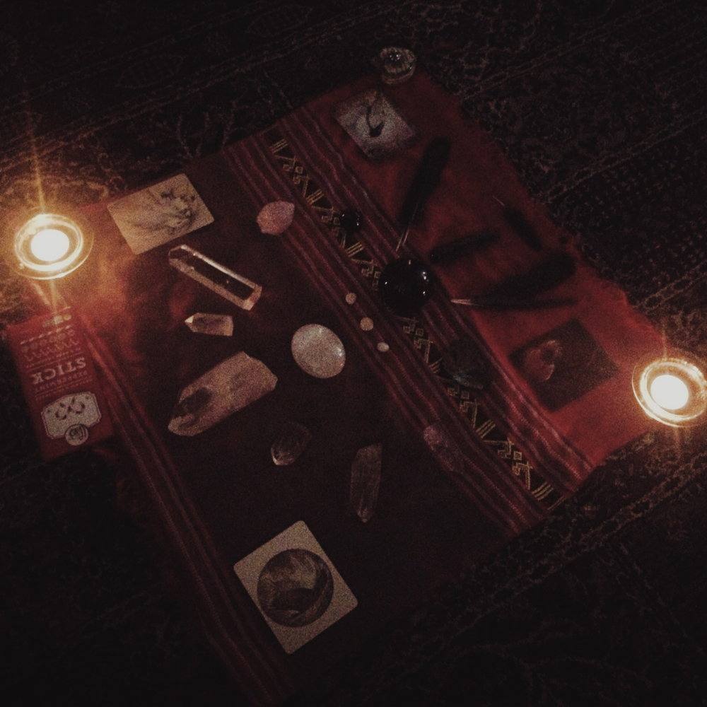 My 2013 Winter Solstice altar included crystals, Crow feathers, candles, and oracle cards. This altar represented the duality of both light, and darkness.