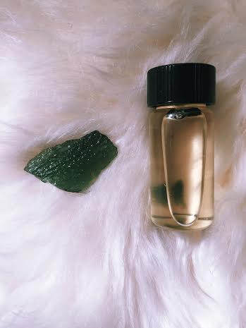 Moldavite specimen with Moldavite infused oil.
