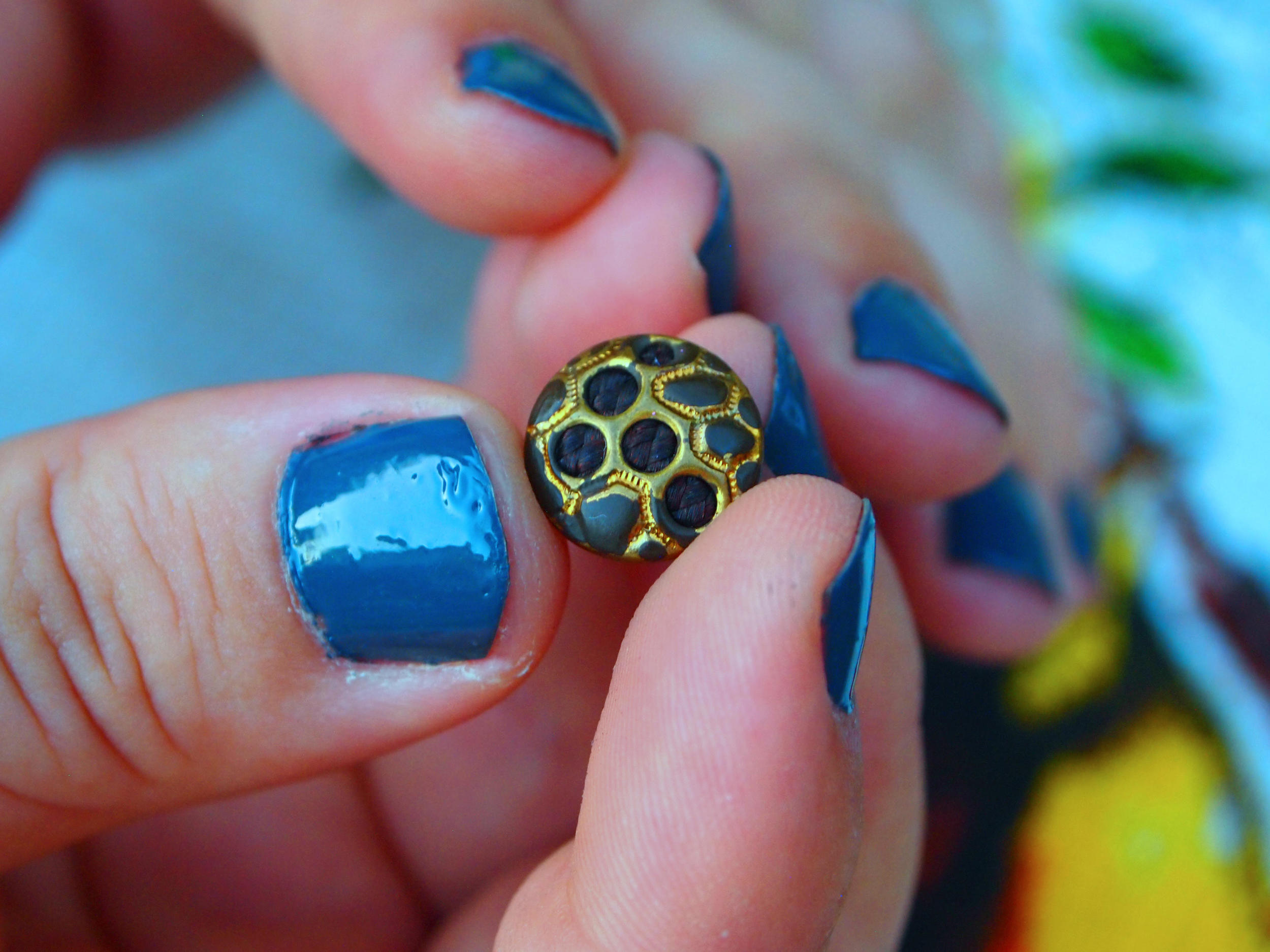 Tina Hyland showcases her Victorian hair button. 