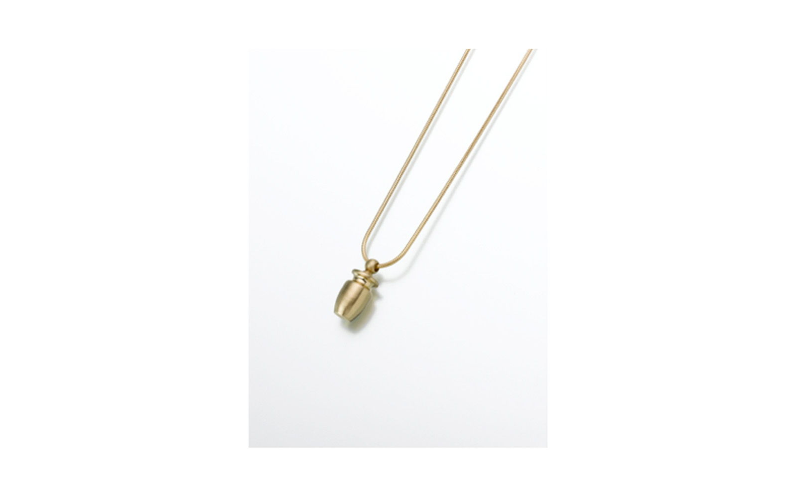 Small Brass Urn Pendant Measures 7/16”W x 11/16”H, Chain not included, $90