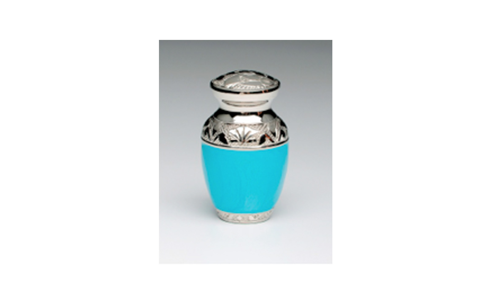 Baby Blue & Baby Pink Keepsake This keepsake comes in either Baby Blue (shown) or Baby Pink Enamel over Nickel Plated Brass. It has a Threaded Lid, Felt-lined base, and comes with a Velvet Box. Measures 3" H x 2" W, 3 Cu. Inches, up to 2 lbs., $45