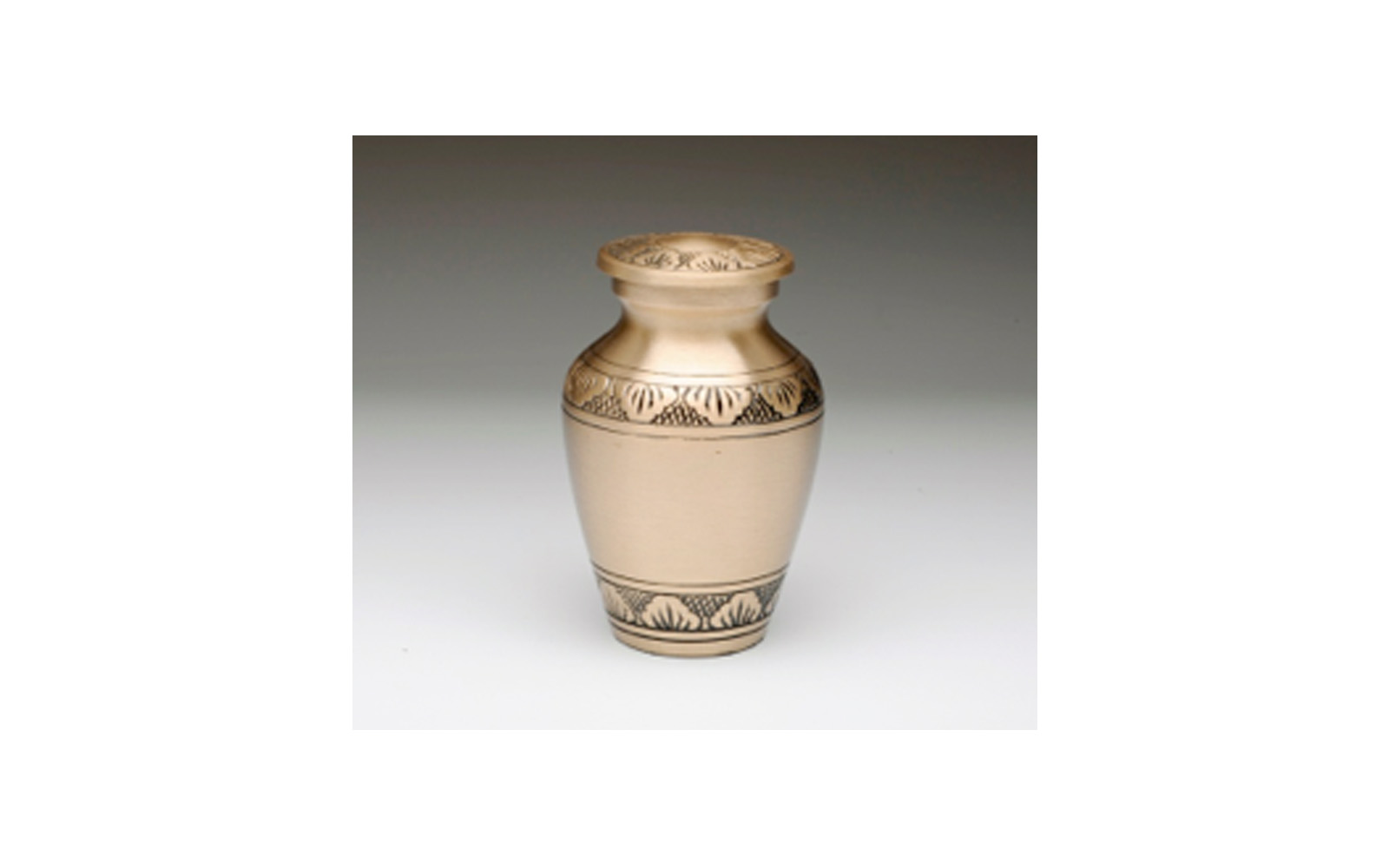 Athena Brass & Pewter Keepsake This keepsake comes in either Brushed Brass (shown) or Pewter with a Hand Tooled Design, Threaded Lid, Felt-Lined Base, and a Velvet Box. Measures 2.75” H x 1.75” W, 3 Cu. Inches, up to 2 lbs., $45