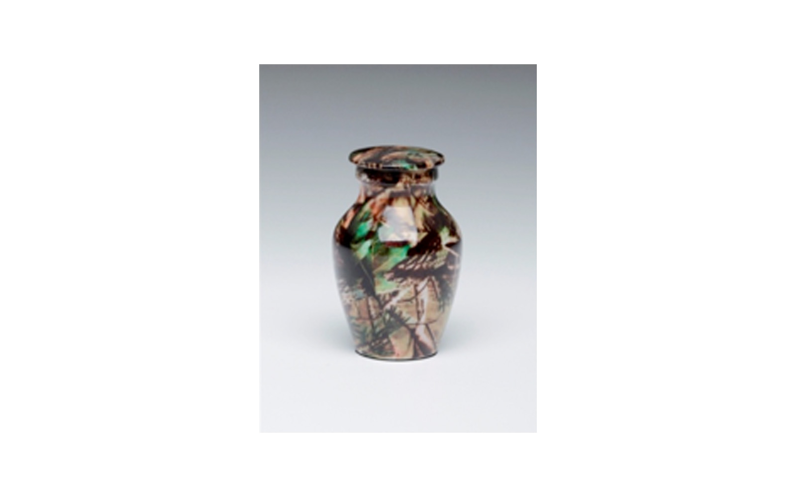 Mossy Oak Camouflage Keepsake This keepsake displays a "Camouflage" Design, is highly durable, and has a Threaded Lid. Measures 2 ¾” H, 3 Cu. Inches, up to 2 lbs., $45