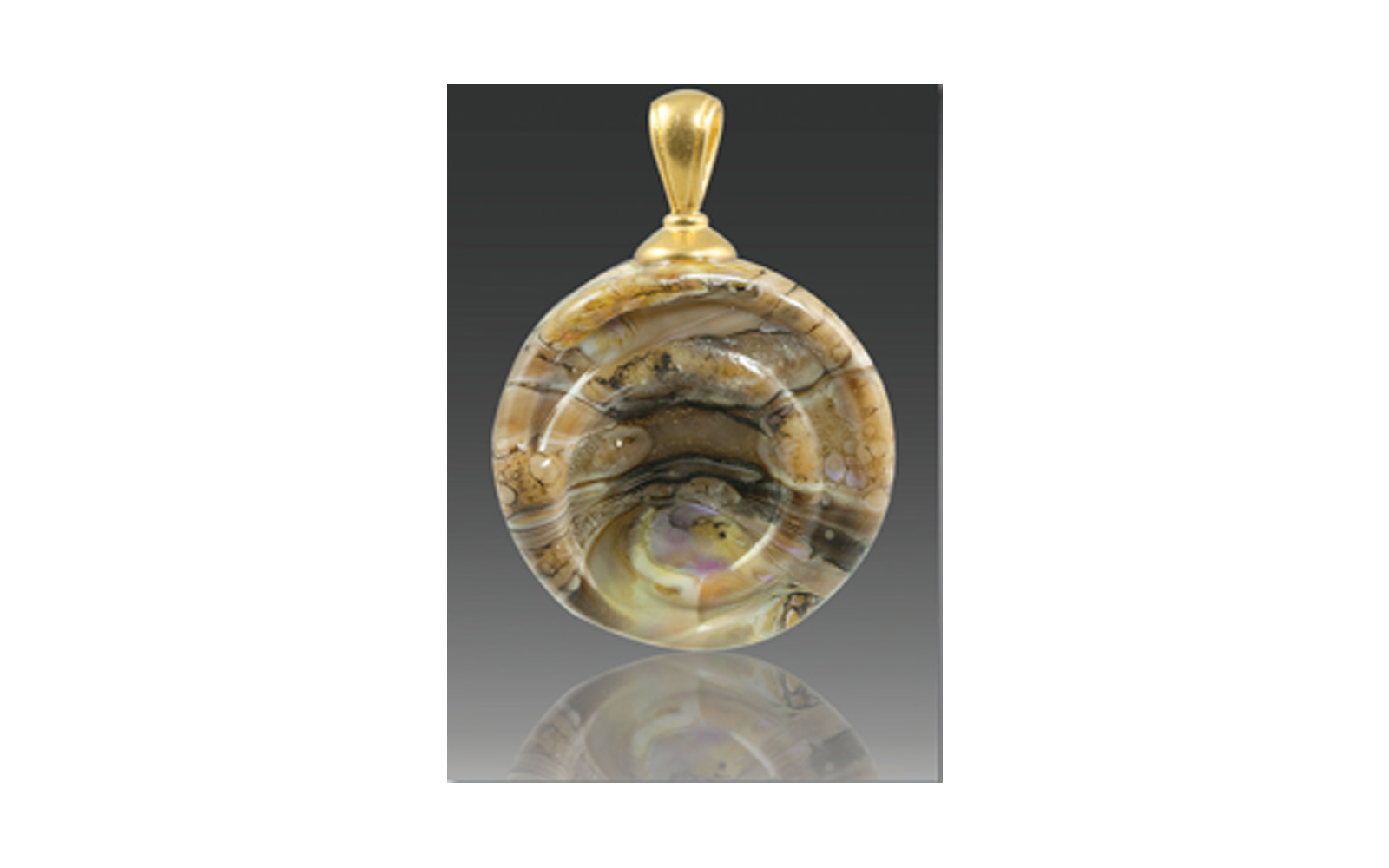 Helix Pendant This Pendant is available in Calico, Turquoise, Fossil, or Black Granite colors with your choice of a silver or gold, plated bail. It contains your loved one's cremated remains swirling throughout the pendant with a spiral embossed on it. Measuring approximately 1" across not including the size of the bail and is custom made to order and comes with a leather cord. $195