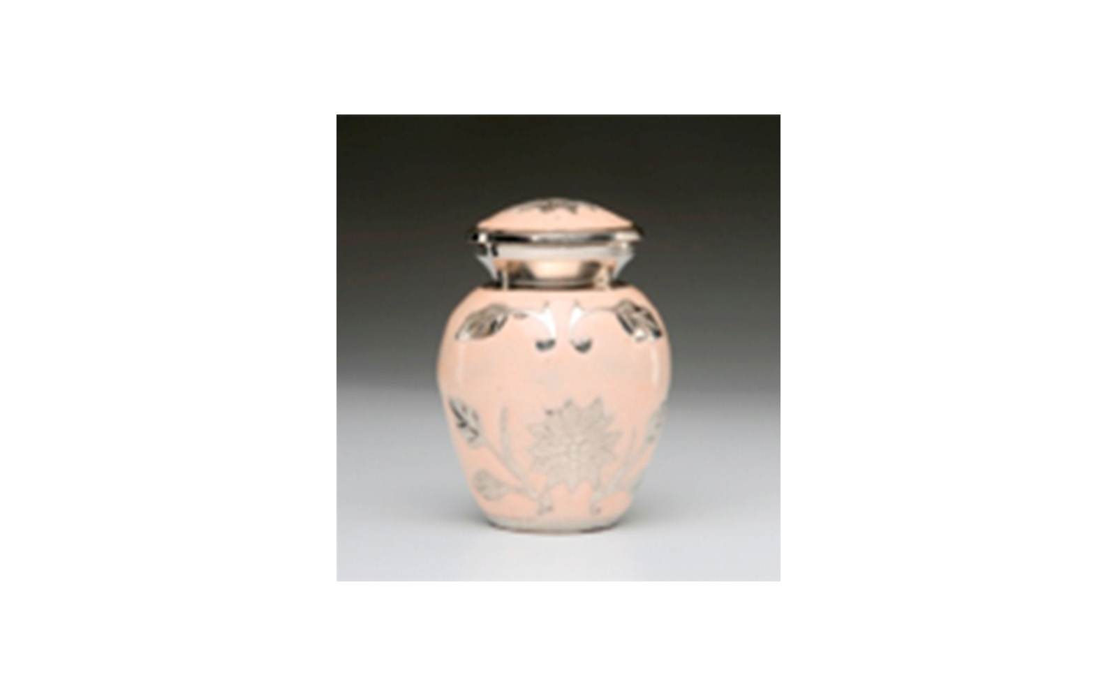 Flowered Peach Colored Keepsake This elegant urn is made of a Peach Colored Enamel over Nickel Plated Brass. It has a Hand-Tooled Flower Design, Threaded Lid, a Felt-Lined Base, and comes in a Velvet Box. Measures 3” x 2.25” H, 3 Cu. Inches, up to 2 lbs., $55