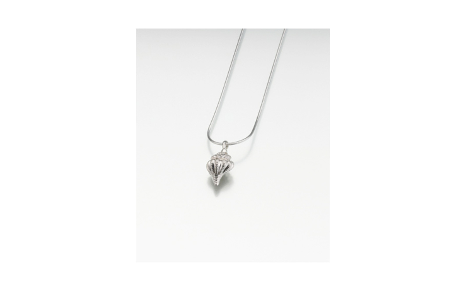 Sterling Silver Conch Shell Pendant Measures 5/8"W x 3/4"H , Chain not included, $150