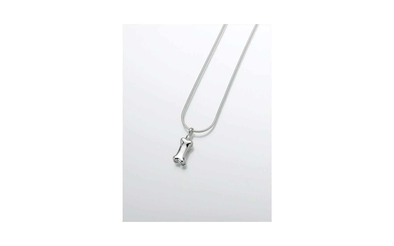 Sterling Silver Dog Bone Pendant Measures 3/8”W x 3/4”H, Chain not included, $130