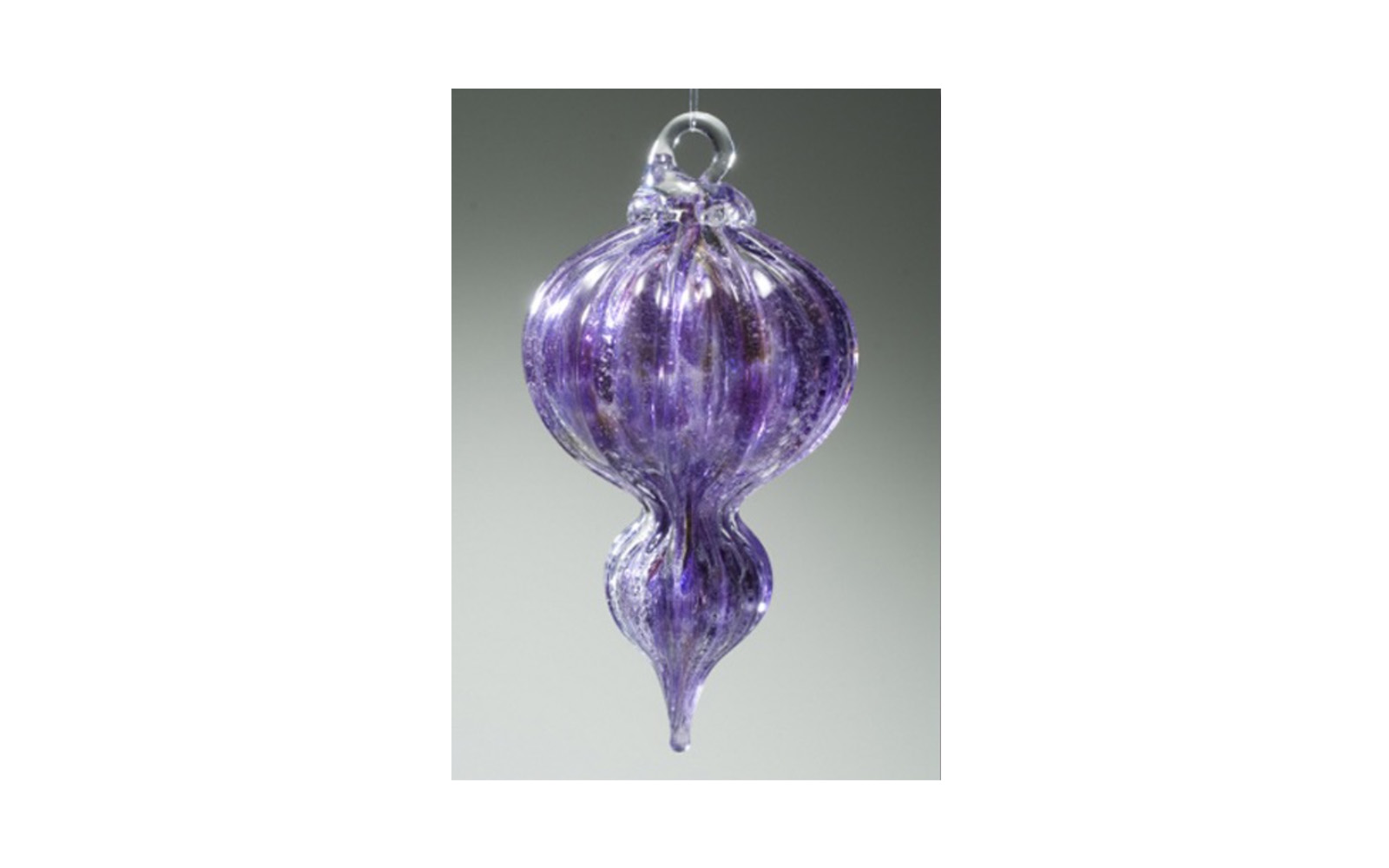 Solace Ornament When the glass is molten your loved ones cremated remains become part of the glass used to create your ornament. It is custom made in the color that you choose from our available jewel tone list. All ornaments have a glass hook for hanging on a Christmas tree or all year round as a window adornament. An additional fee applies for etching for up to 10 characters on the hook base. This ornament is 5.5" high. $150