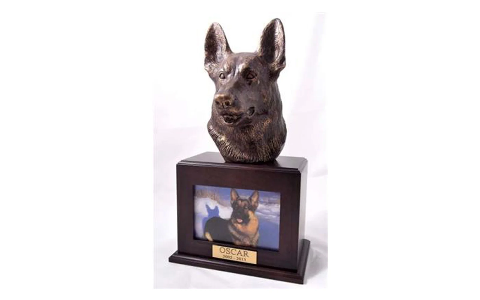 German Shepherd Picture Urn Walnut This photo urn features a sculpted German Shepherd set on genuine Walnut wood urn. The sculpture is made of polymer with a bronze additive. Measures 9" W x 6" D x 16" H and holds 110 cubic inches, up to 110 lbs. The sculpture measures 6" W x 8" D x 9" H., $265 with name plate $240 without name plate 