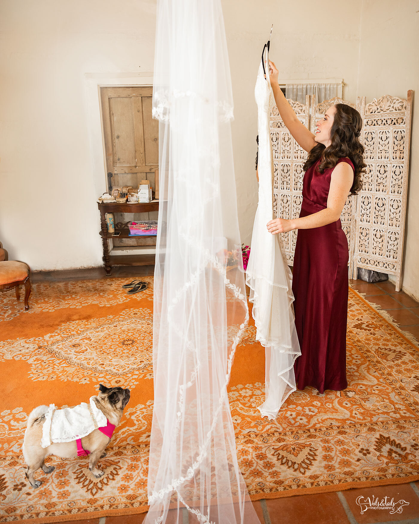 wedding day getting ready, dog and maid of honor at Santa Barbara Historical Museum