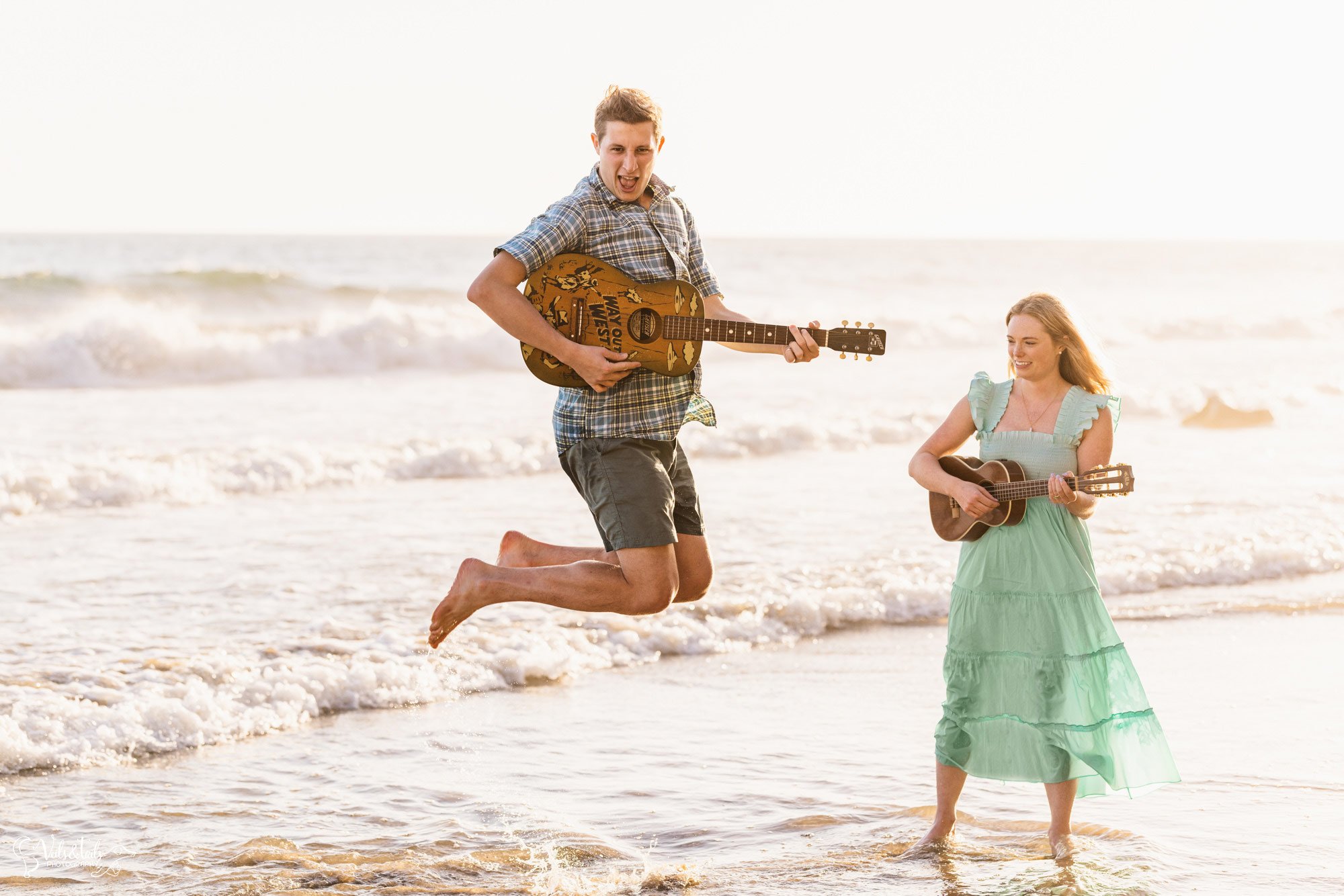 Santa Barbara photographer, beach engagement session leaping guitars