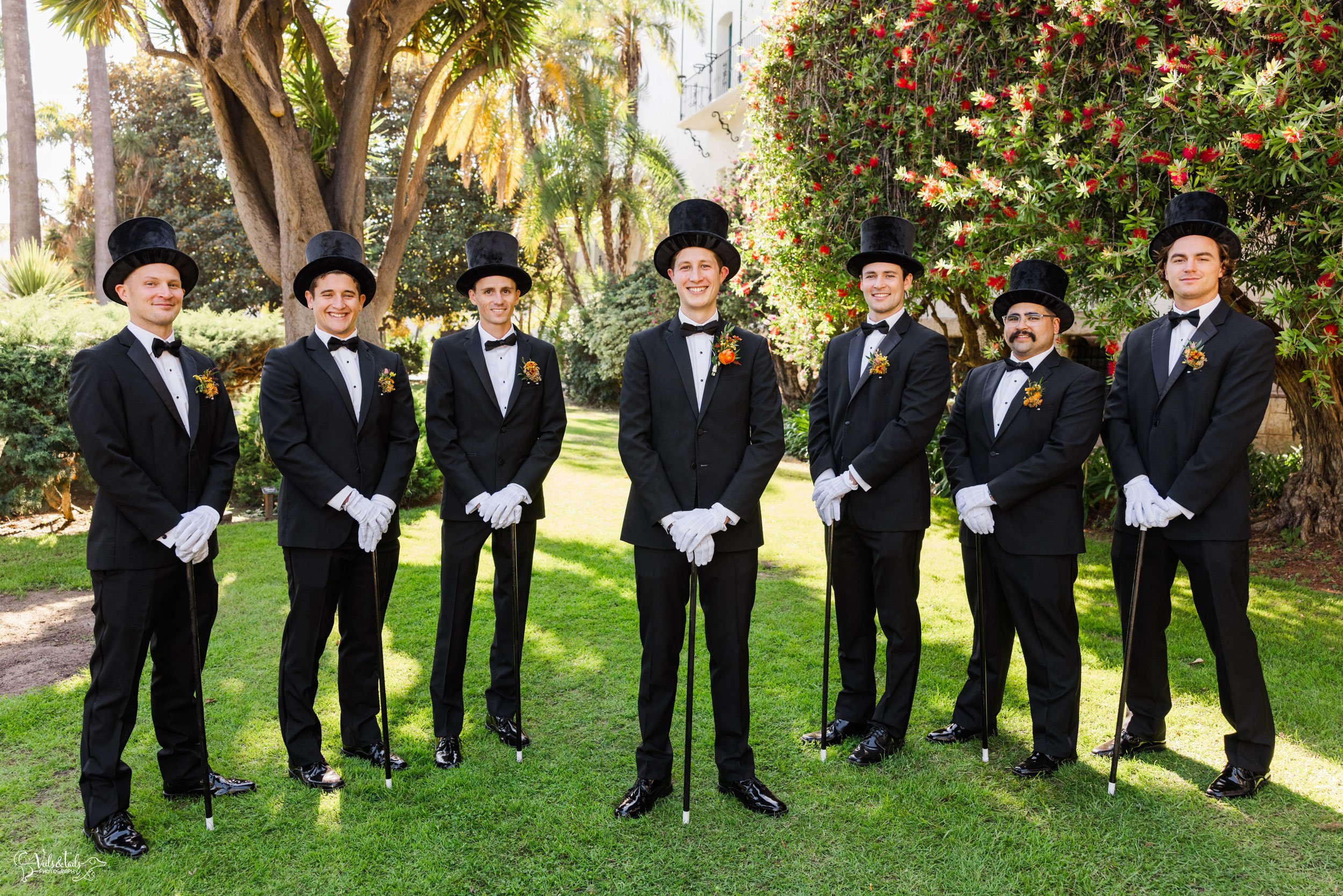 joyful Santa Barbara Wedding Photographer Courthouse groomsmen in tophats