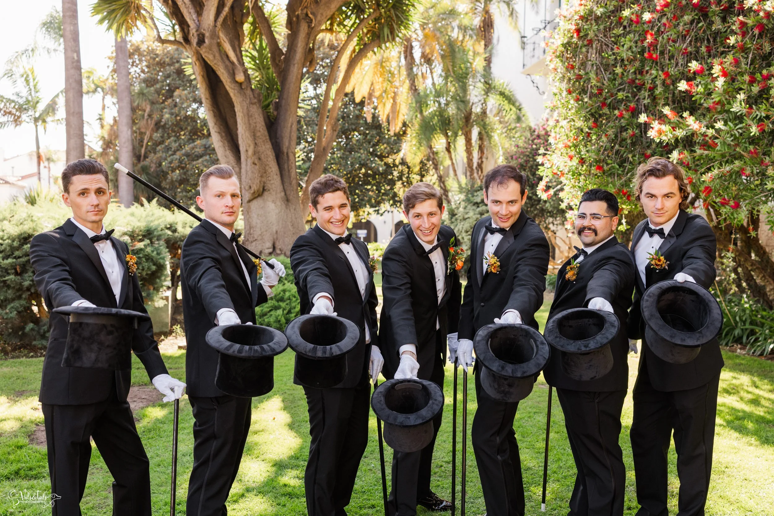joyful Santa Barbara Wedding Photographer Courthouse groomsmen in tophats