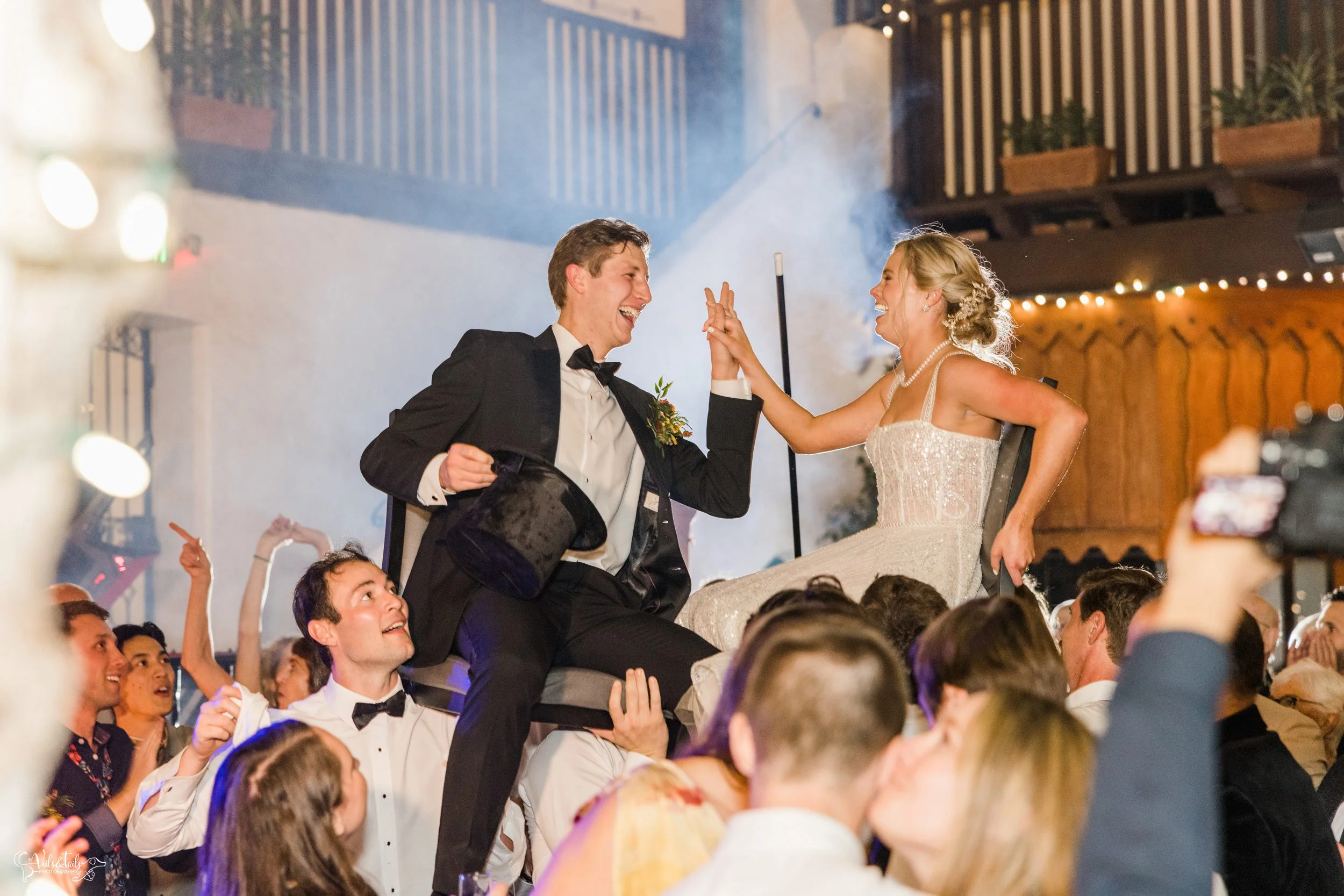 Santa Barbara Wedding Photographer reception El Paseo dancing crowd surfing couple