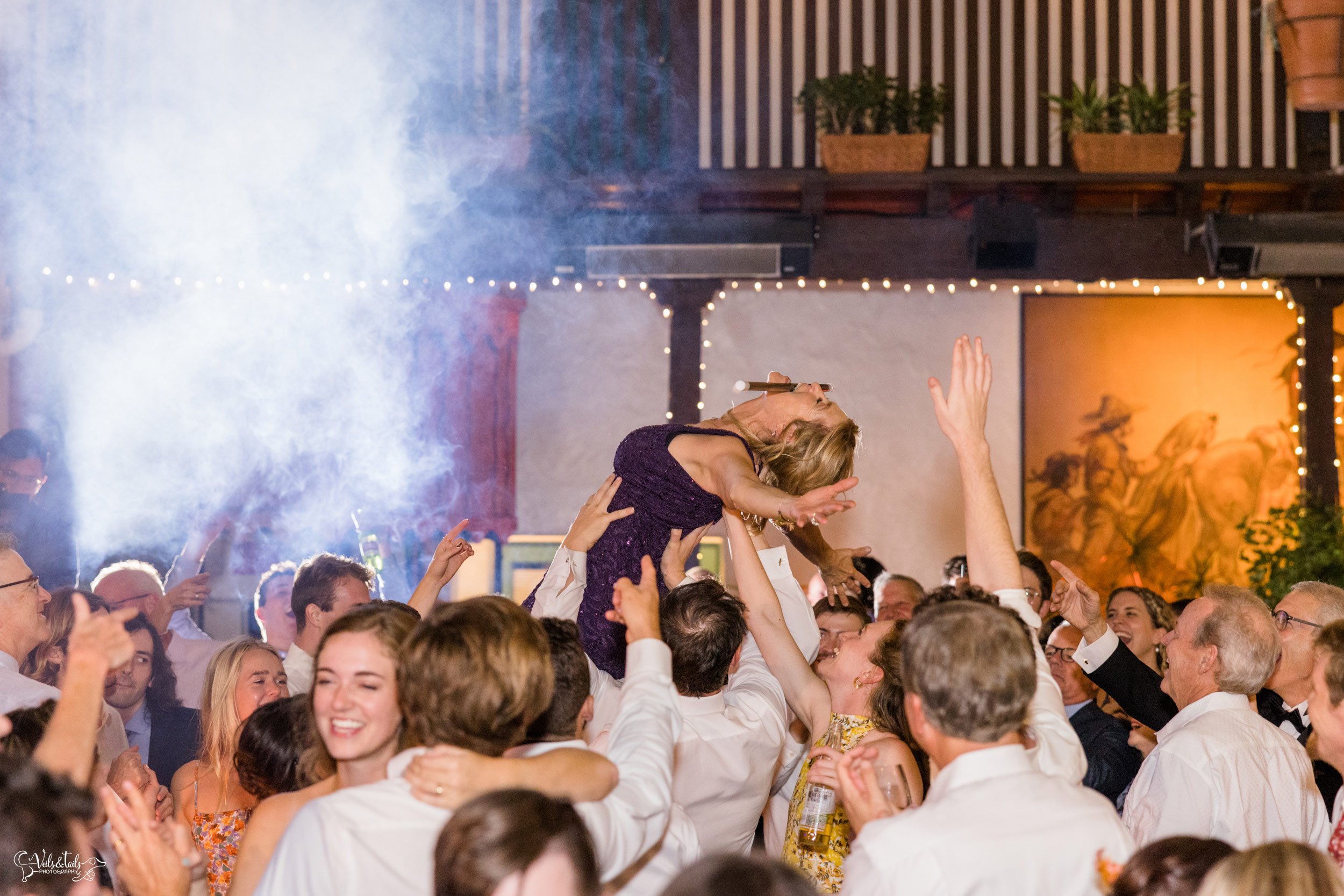Santa Barbara Wedding Photographer reception El Paseo dancing crowd surfing