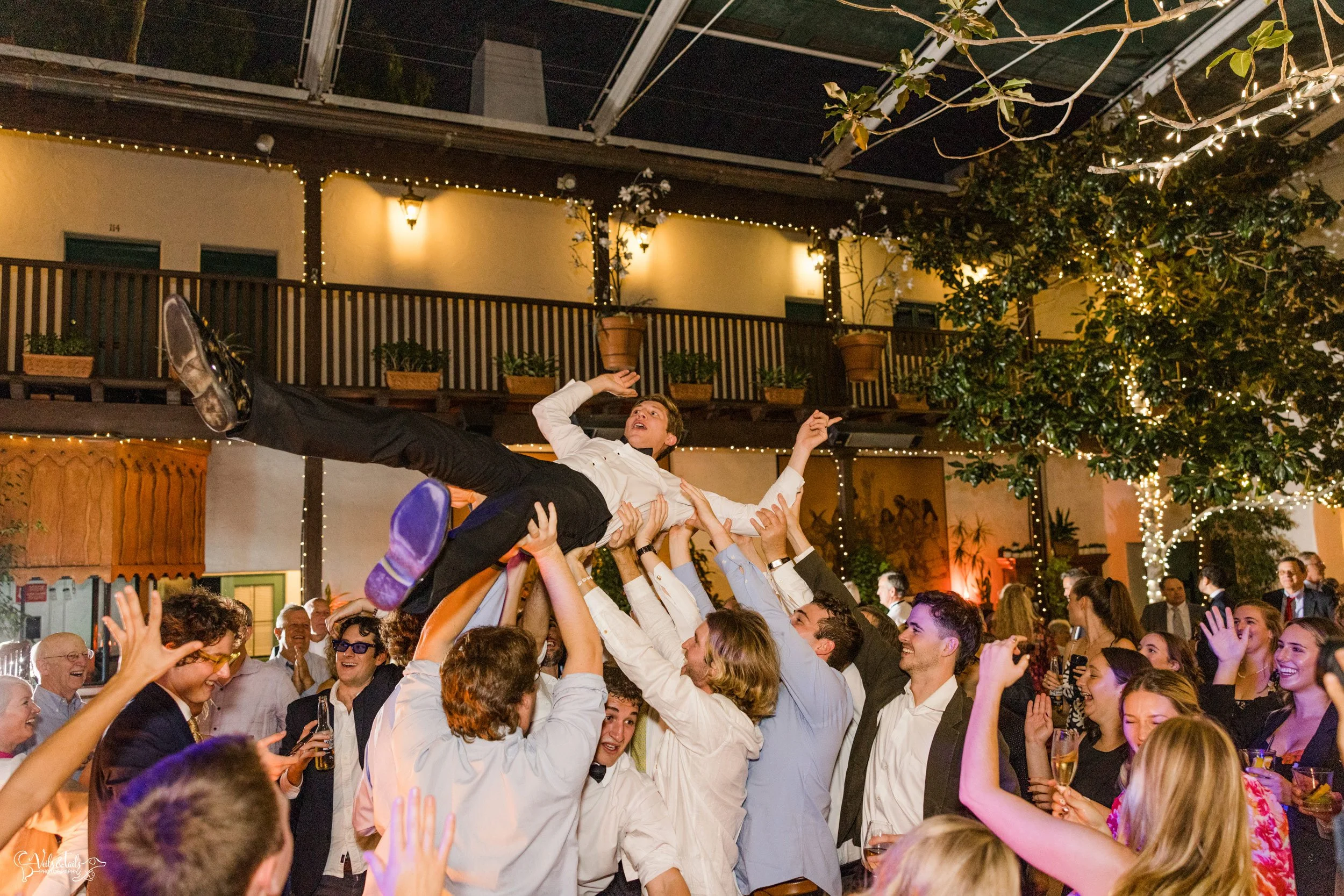 Santa Barbara Wedding Photographer reception El Paseo dancing crowd surfing