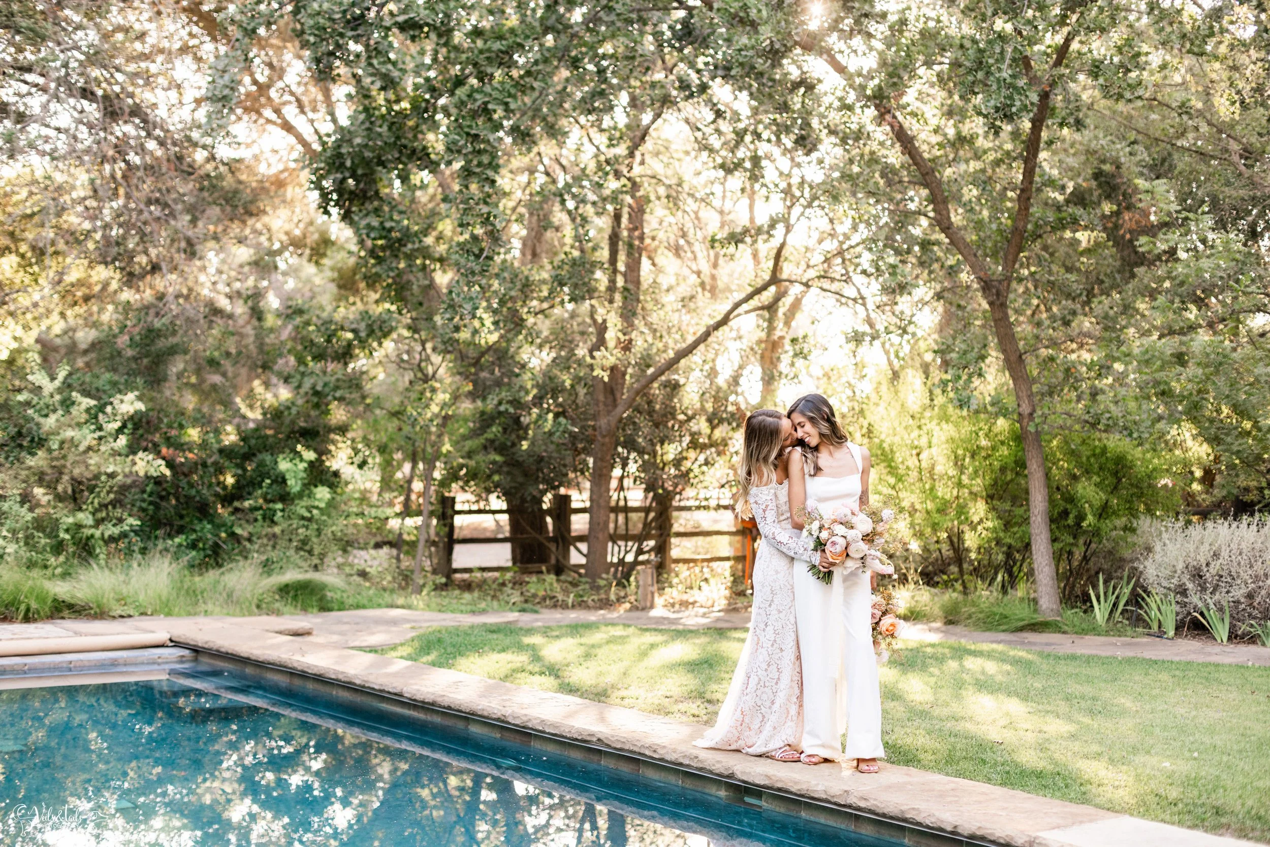 LGBTQ+ wedding photography; candid bridal portraits by swimming pool, Lieff Ranch in Santa Ynez, Veils &amp; Tails Photography