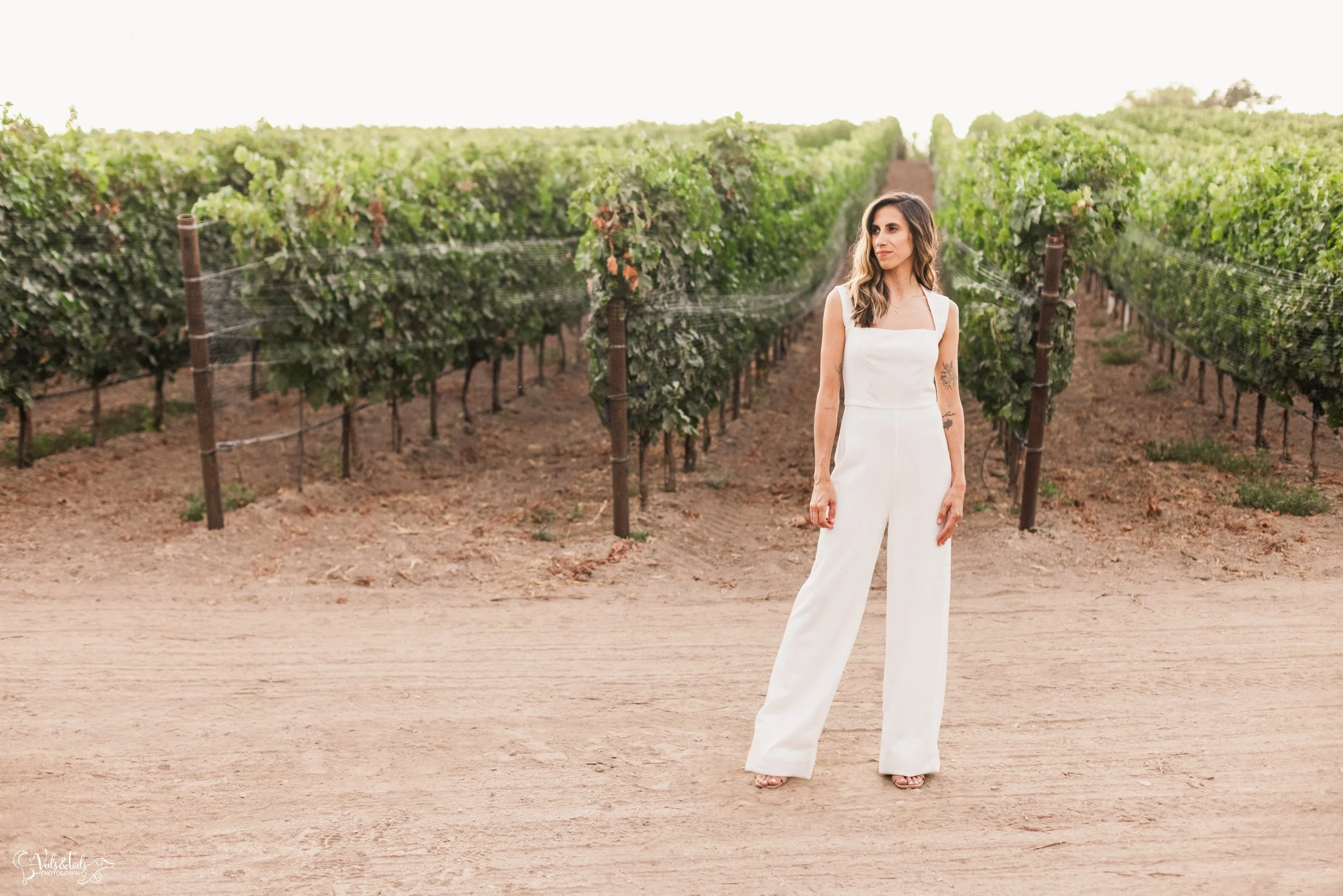 LGBTQ+ elopement photography; champagne pop at Lieff Ranch vineyard in Santa Ynez, Veils &amp; Tails Photography