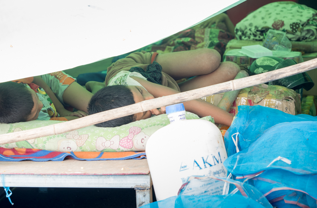 Family sleeping under plastic and tarpaulin at the side of the road..... Very tough indeed.....