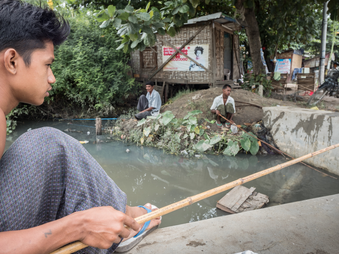 Fishing for dinner in a tiny dirty looking inner city flow.