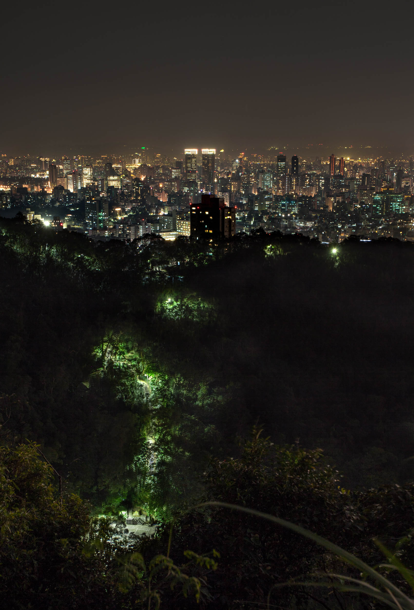 An illuminated pathway leads from Elephant Hill back towards the edge of the city.....
