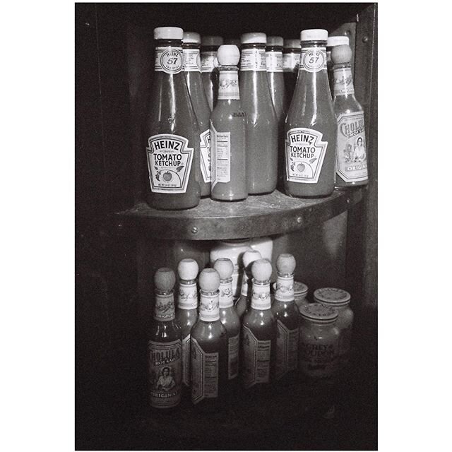 Stockpiling of the finest order? Just a shot from a cafe from a while ago... .
.
.
.
.
.
#yashicat5 #ilforddelta400 #bw #filmisnotdead #35mm #spicollective #analoguevibes #theanalogclub #photofilmy #filmphotographic #grainisgood #thefilmcommunity #ev