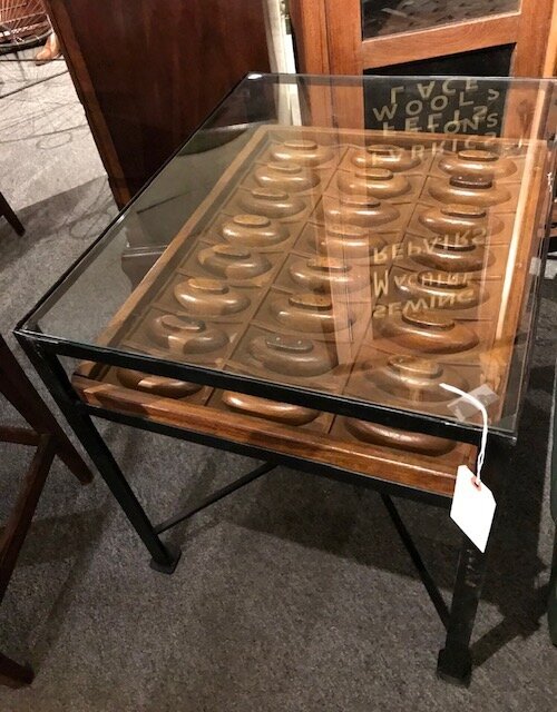 Glass top coffee table made from reclaimed industrial mold