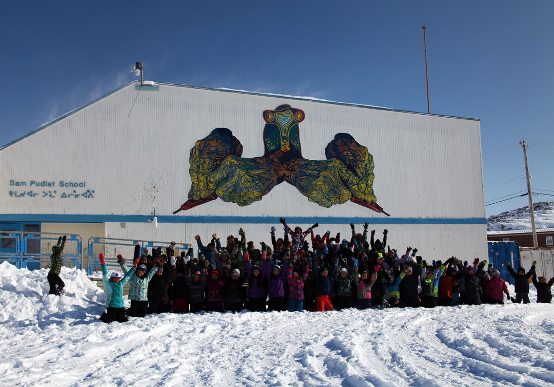 MINE YOUR IMAGINATION, Cape Dorset, Nunavut, Canada, 2014-2015 18x36', latex on mounted plywood We created the hans in the mural by making original linocut prints, and projecting and painting them cut-for-cut: our way of giving a nod to the inspiring printmaking in Cape Dorset, past and present. The bird head was created by Parr Etidloie, 15 years old. ( http://dorsetfinearts.com/aboutus.php)