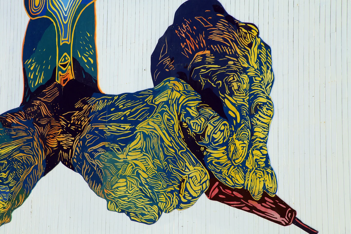 MINE YOUR IMAGINATION, Cape Dorset, Nunavut, Canada, 2014-2015 18x36', latex on mounted plywood We created the hans in the mural by making original linocut prints, and projecting and painting them cut-for-cut: our way of giving a nod to the inspiring printmaking in Cape Dorset, past and present. The bird head was created by Parr Etidloie, 15 years old. ( http://dorsetfinearts.com/aboutus.php)