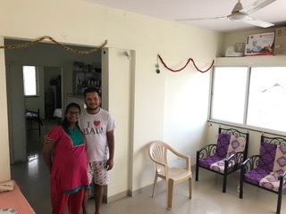 Kishan and Luton in their new apartment