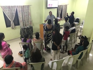 Edgar leading prayer for Regions Beyond churches around the world