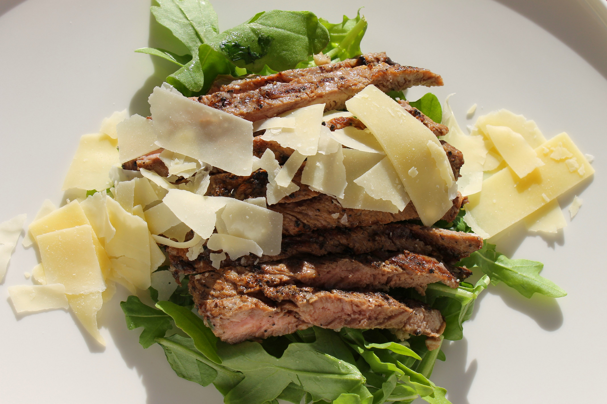 Skirt steak over arugula