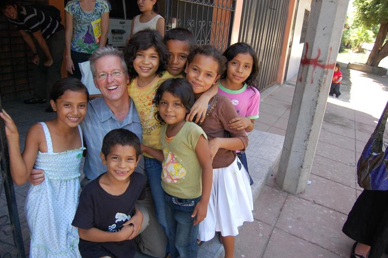 Dr. Vanderpool surrounded by children (Photo from Livebeyond.org website)