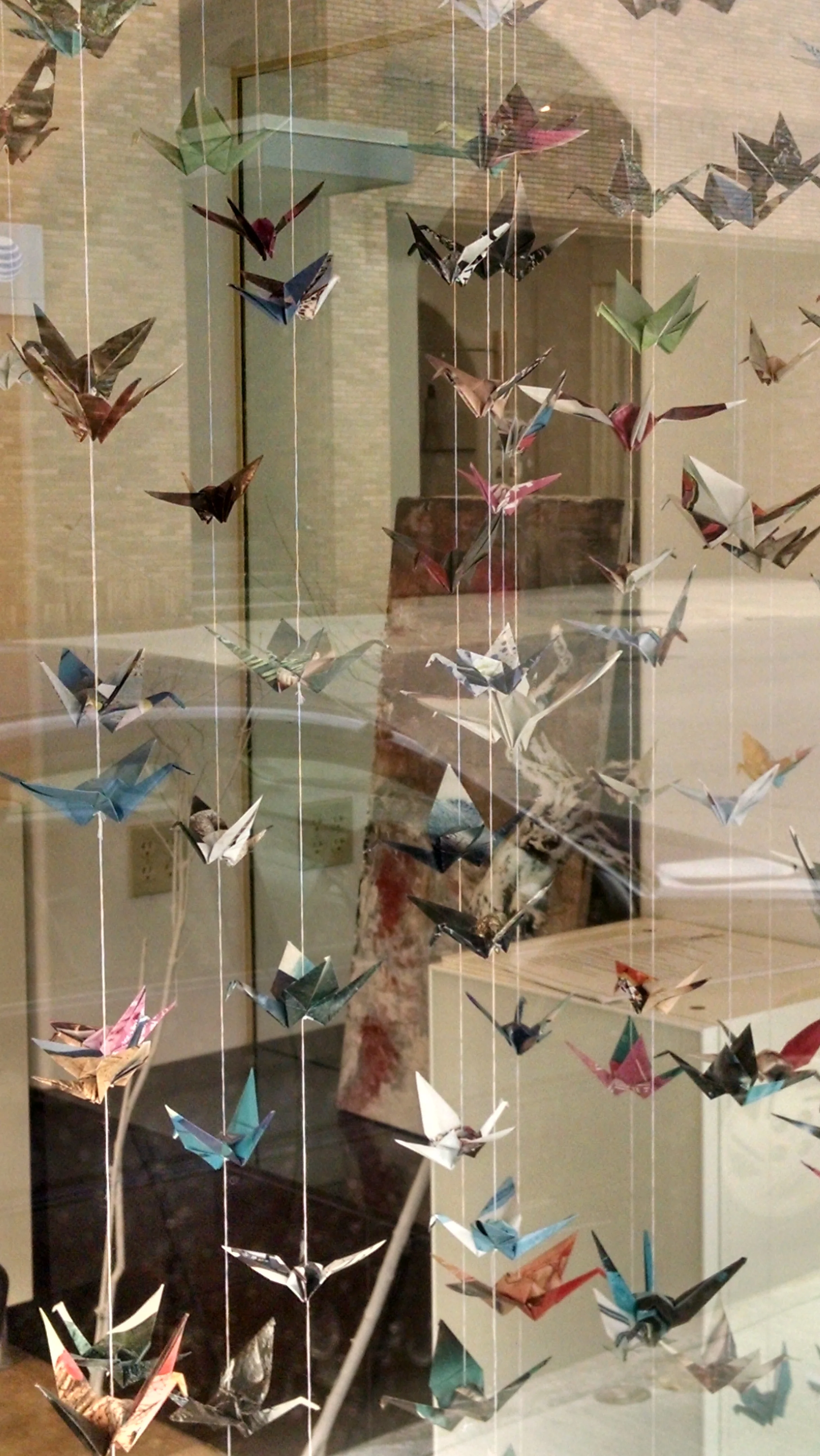 Drue Salon window with commissioned paper cranes