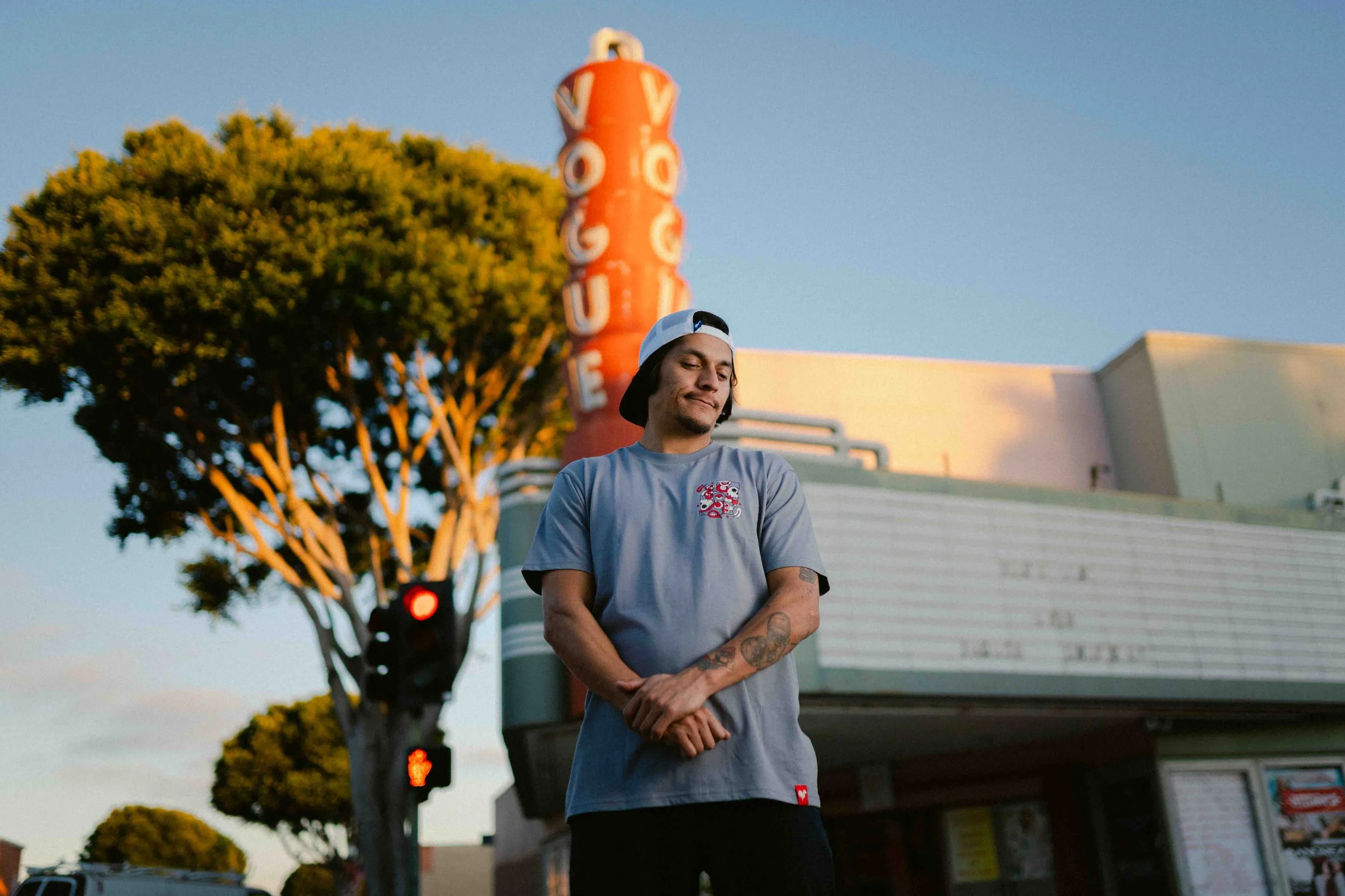 Moose professional skateboarder standing by the vogue theater in Downtown Oxnard photographed by Humberto Rosales