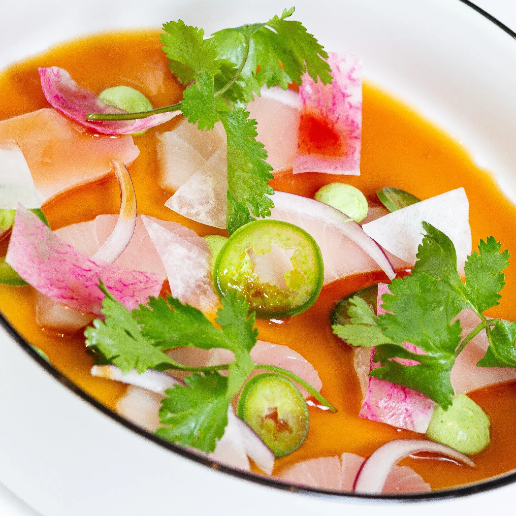 Light, fresh and exactly how we like to begin the night.

yellowtail hamachi sashimi
avocado crema, radish, cilantro, ponzu, jalape&ntilde;o