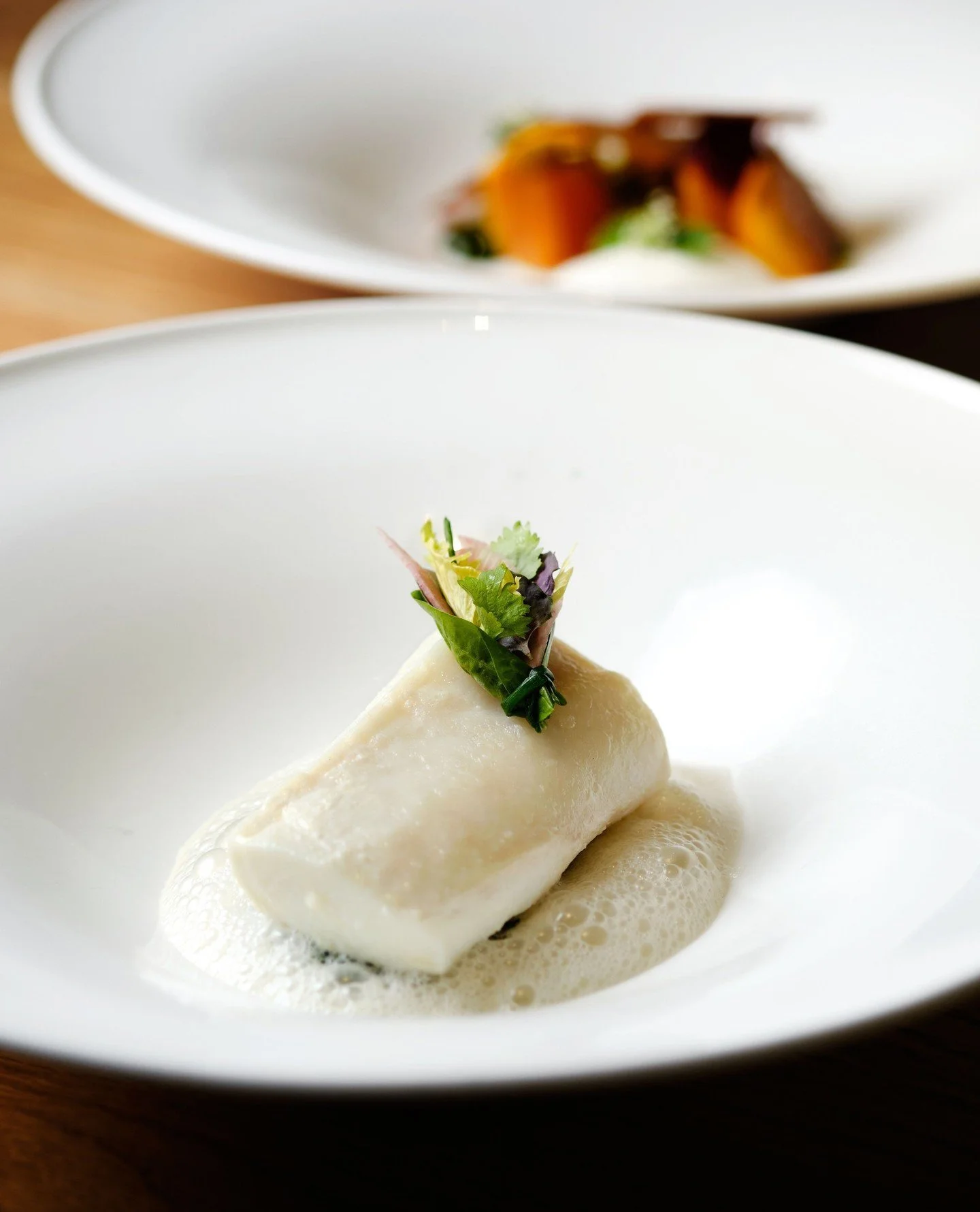 A study in simplicity.⁠
Brown butter poached halibut with bacon, spinach and kombu velout&eacute;.
