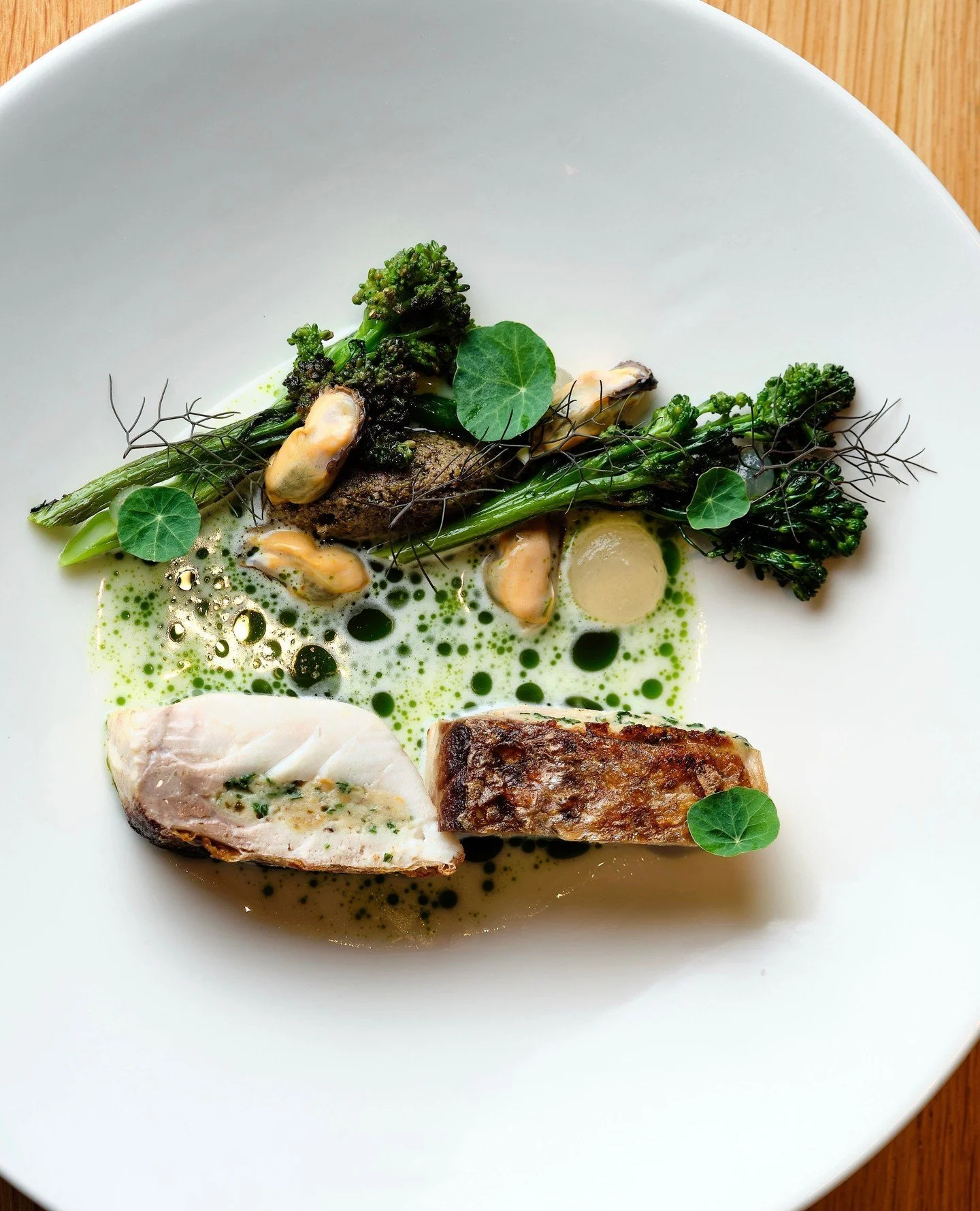 A thoughtful balance of flavor, texture and technique. ✨⁠
⁠
Executive Chef Austin Goetzman&rsquo;s Stuffed Madai brings together mussels, sweet and sour gel&eacute;e, charred broccolini, caper condiment, buttermilk fum&eacute; and chive oil.⁠
⁠
A ref
