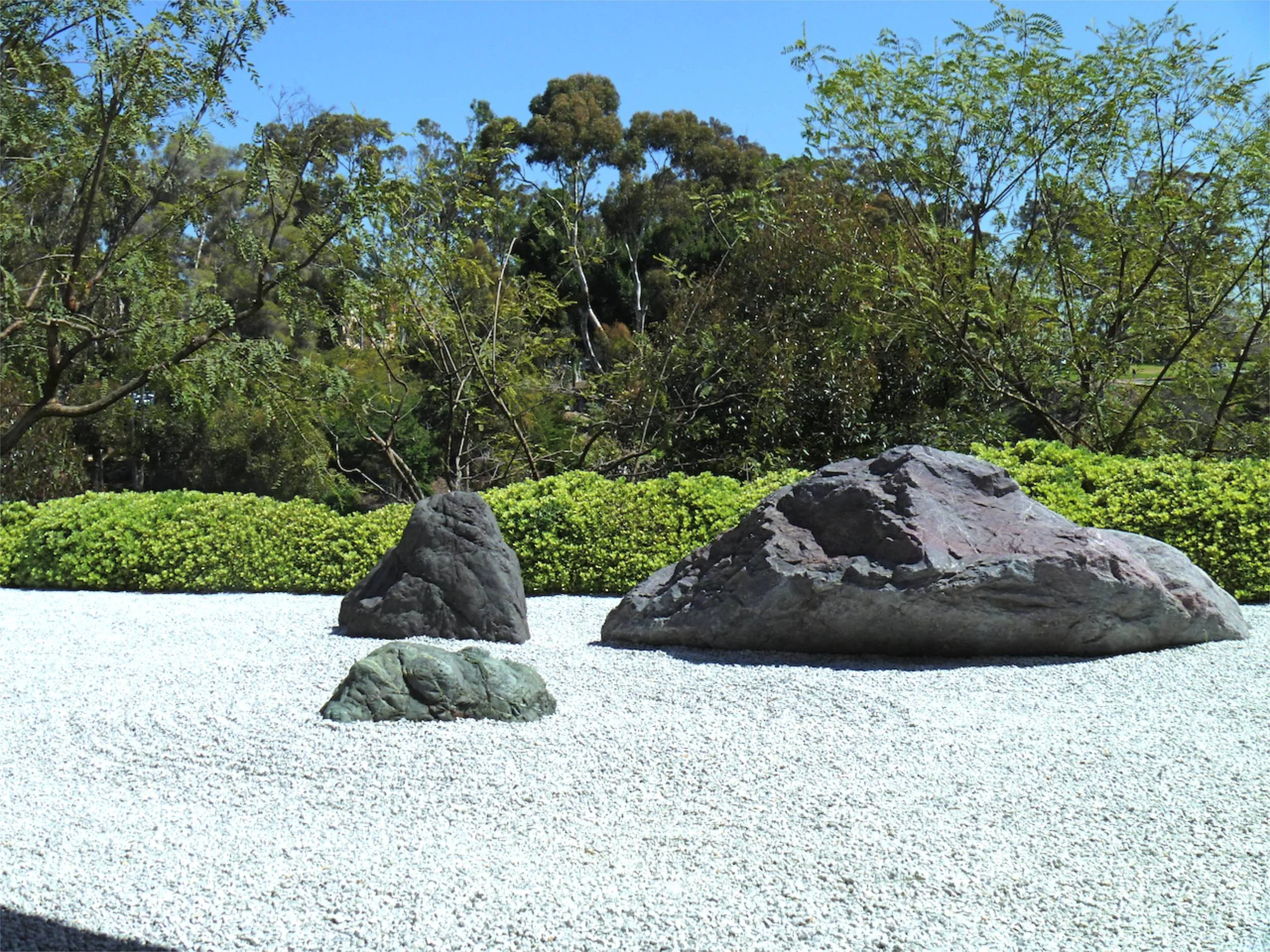 This rock garden represents islands in a sea. Large rocks are typically placed in 3's to represent the Buddhist trinity of heaven, earth, and man.
