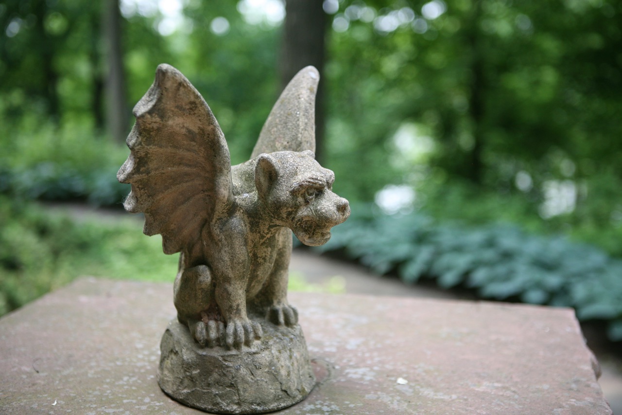    A gargoyle keeps watch over the back garden   and adds a surprise, personal element.     