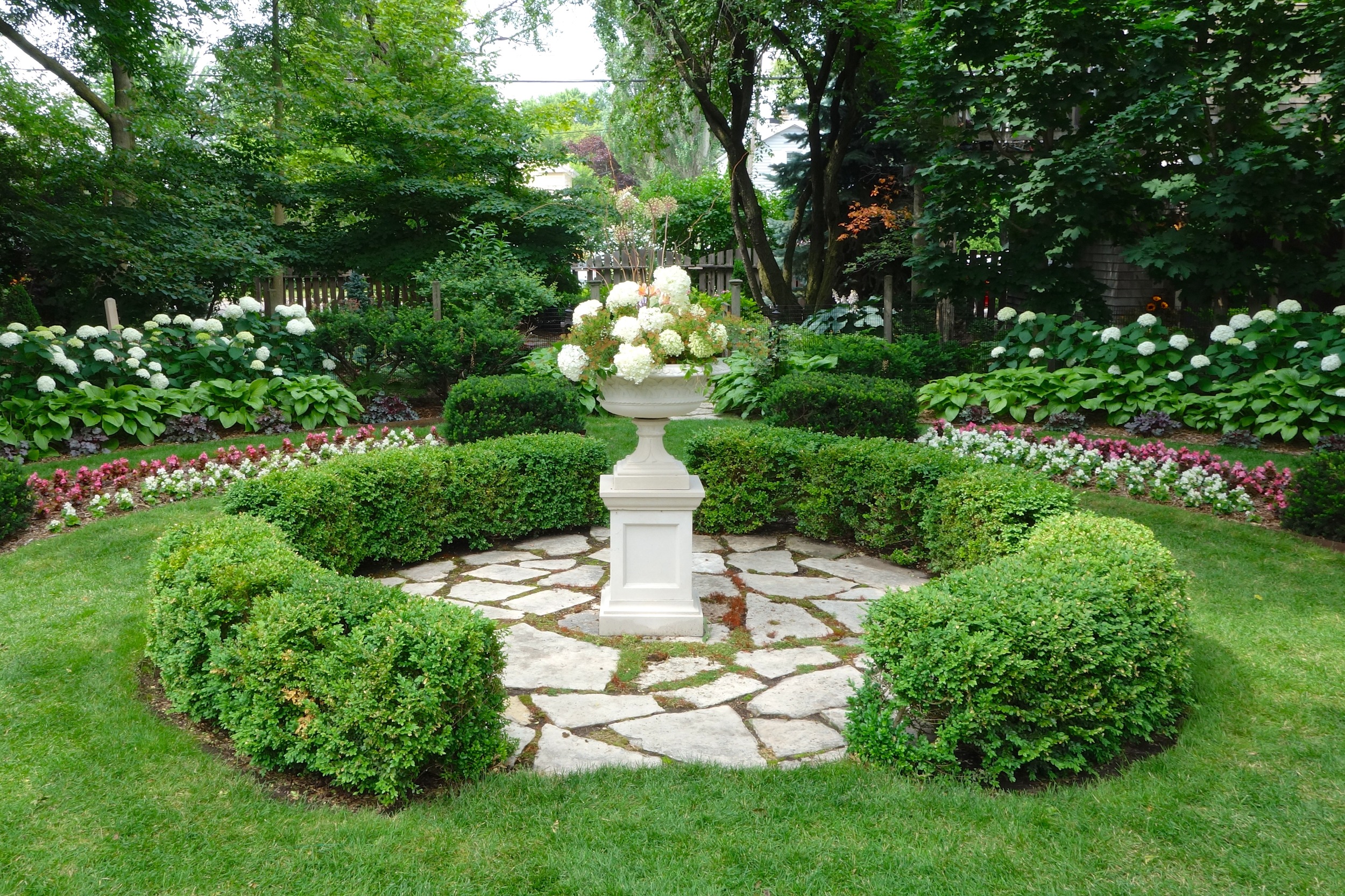      This classic stone urn and pedestal sit on what was originally the sunken rose garden.&nbsp; A perfect focal point.       