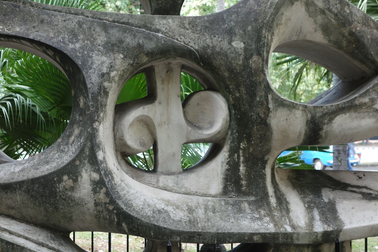 Detail from "Crisalida" (1959) by Alfredo Lozano is set in the middle of a quiet palm grove.  Crisalida means chrysalis in English.