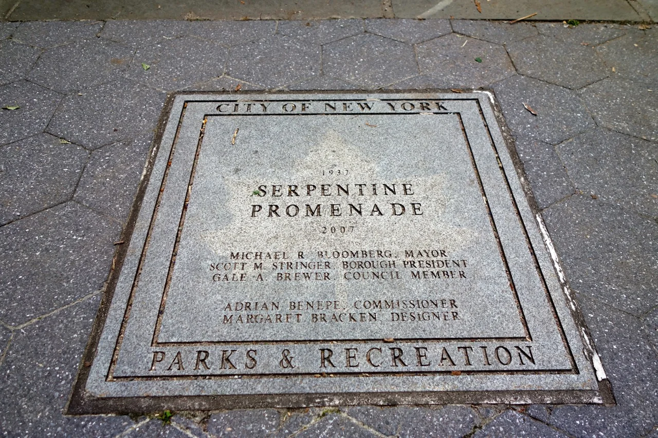 The Serpentine Promenade, built in the 1930's, covered railroad tracks and created a middle level to the park.