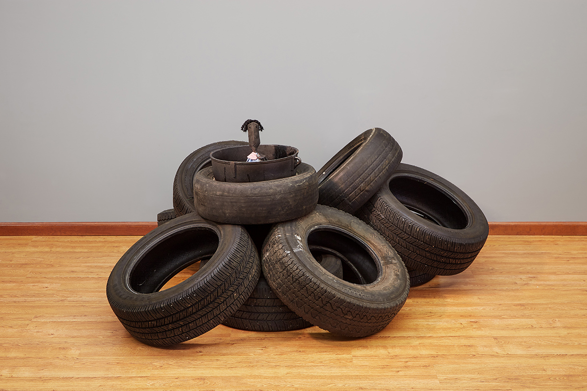 Tar Baby , 36”x 50”x 66”, tires, jambalaya pot, hand sewn folk art doll, tar, 2018