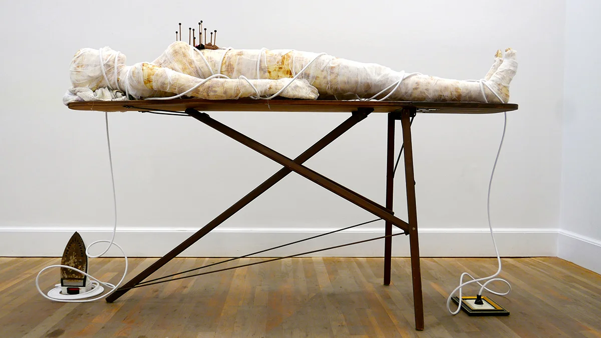 Power Figure , 42"x 76"x 50", iron, cord, plug, ironing board, mannequin, paper, cheese cloth, knitting needles, stockings, tights, nylons, finger nails, hair, herbs, safety pin, towel, 2017