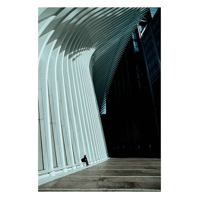 Across from the World Trade Center, a lone woman sat with her bags in the ridges of The Oculus. She was there when I biked in, and there an hour later when my wandering brought me back. She smiled when she saw me raise my camera, and waved goodbye wh
